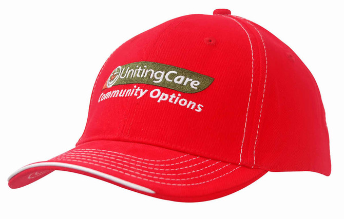 A red cap with contrasting stitching and an embroidered logo on the front. Features a curved brim.