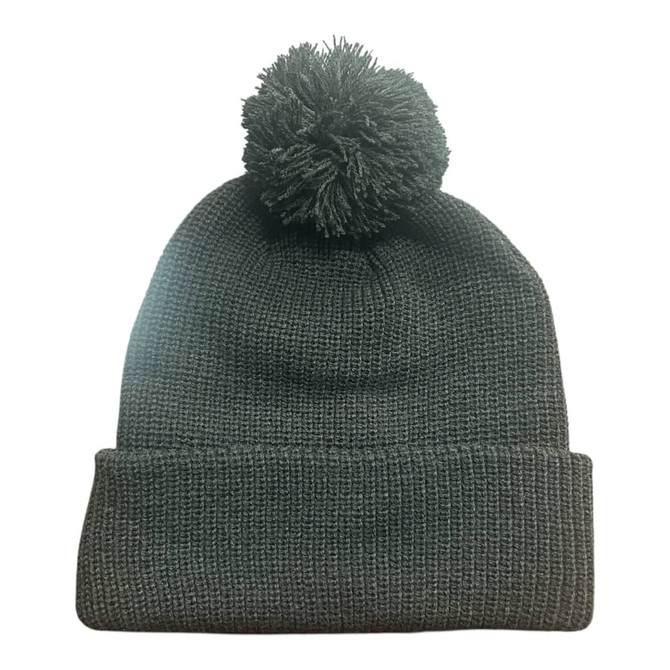 A dark grey knitted beanie featuring a pom pom on top and a folded cuff. It has a branding logo.
