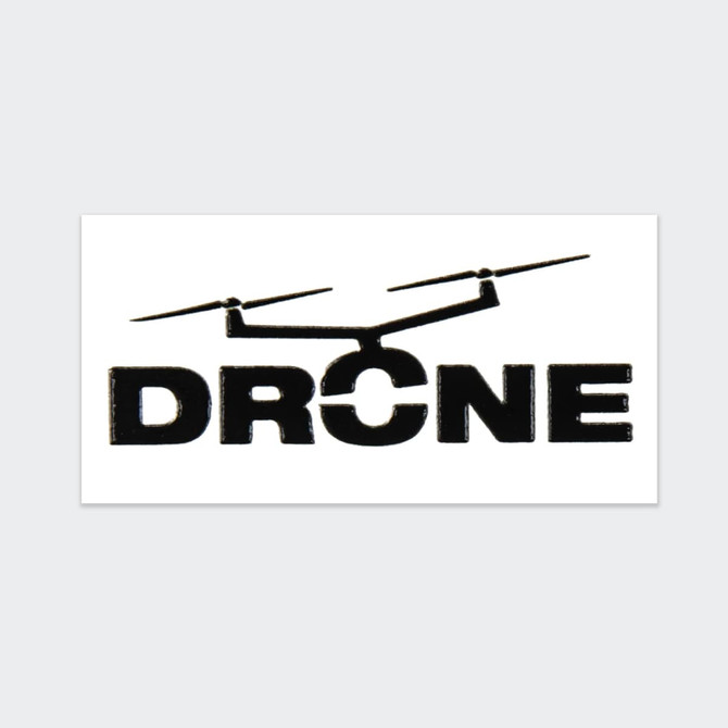 A black sticker featuring a silhouette of a drone above the word "DRONE" in bold letters.