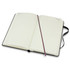 A black Moleskine 2026 Daily Planner, open, featuring lined pages and a ribbon bookmark.