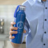 A drink bottle in a vibrant blue colour, featuring a clear cap and a logo on the side.