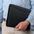 A black portfolio held by a person in a light blue shirt, designed for office and business use.