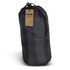 A black puffer blanket stored in a compact roll, with a drawstring closure and a tag attached.