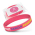 A pink silicone wristband featuring text, packaged for promotional use, with a logo visible on the wrapper.