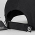 A black Swiss Peak 5 Panel Cap featuring a logo and an adjustable strap on the back.