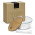 A glass food container with a bamboo lid, accompanied by a white silicone band and packaged in a cardboard box.