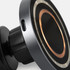 A wireless car charger in black and metallic silver, featuring a circular design and a charging port.