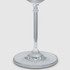 A clear glass gin glass featuring a slender stem and wide base, elegantly designed for serving beverages.