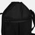 A black bag with a zippered pocket and an adjustable strap, featuring a solid colour design.