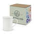 A white bone china coffee mug beside a decorative box featuring floral designs and a logo.