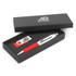 A gift set including a red and white pen, a USB drive, and a branded black box.