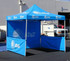 A blue promotional tent with a peaked roof and side walls, featuring a logo and branding.