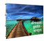 A promotional media wall replacement skin featuring a vibrant beach scene with a wooden pier and clear turquoise water.
