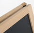 A wooden A-frame chalkboard with a black writing surface and a natural finish. It features a logo.