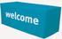A turquoise 6-foot table cover with white lettering. The cover has a logo printed on it.