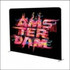 A tension fabric display with a black background featuring vibrant multi-coloured graphics and a logo.