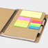 A Kraft notebook featuring a spiral binding, assorted sticky notes in bright colours, and a pen holder.