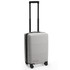 A grey carry-on suitcase with four wheels and a retractable handle, featuring branding on the side.
