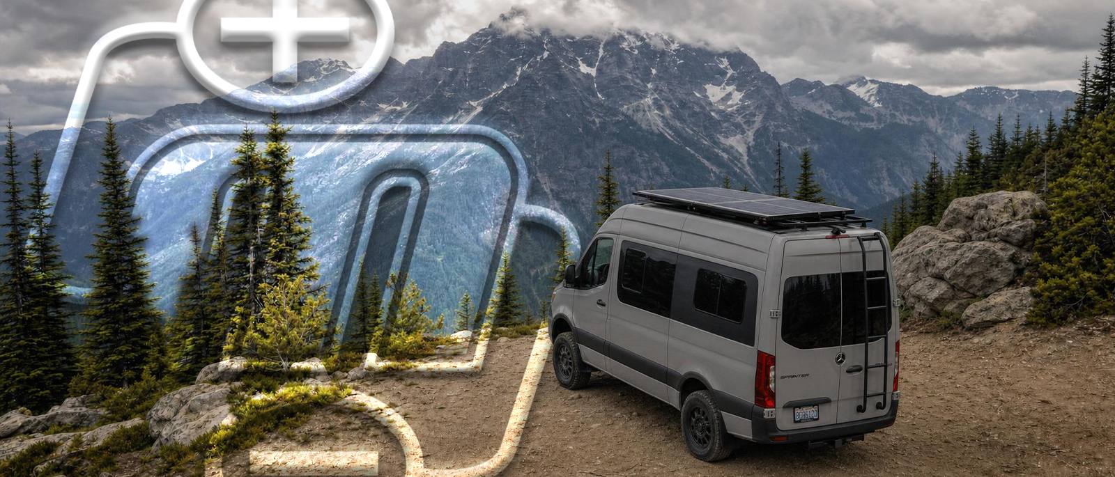 RV with rooftop solar parked off-grid under cloudy mountain skies