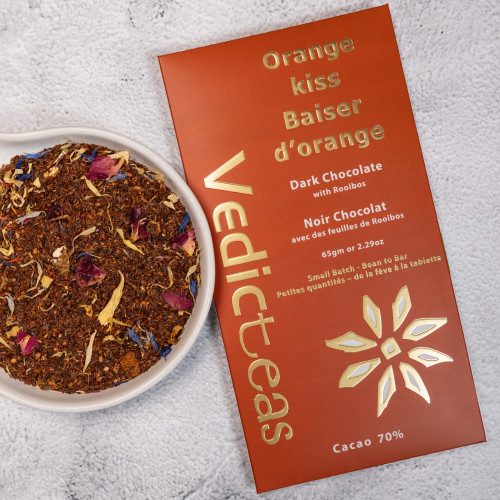 Orange Kiss 70% Dark Chocolate With Background And Rooibos Tea leaves