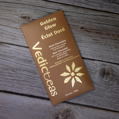 Golden Glow Dark Chocolate With Turmeric, Ginger, Lemongrass with background