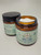 An open amber glass jar showing the thick cream texture of Northland Remedies 1000mg CBD and 1000mg CBG topical lotion.