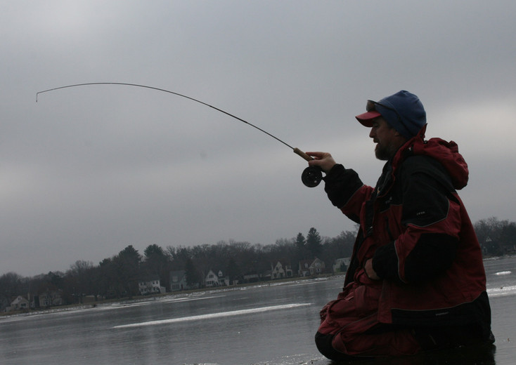 Homemade ice fishing jigging pole with reel 