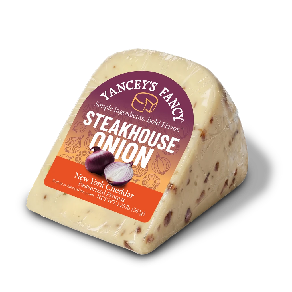 Side profile of packaged Yancey's Fancy Steakhouse Onion Cheddar New York cheese.