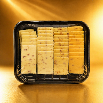 Yancey's Fancy Bacon Bacon Cheese Sampler Pack Unwrapped Package featuring rows of pre-sliced cheese varieties: Bacon Cheddar, Bacon Ranch Cheddar, Jalapeno Cheddar with Bacon, Smoked Gouda with Bacon.