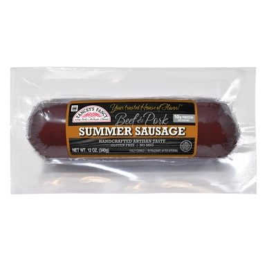 A 12-ounce log of Yancey's Fancy Beef & Pork Summer Sausage, sealed in clear plastic packaging against a white background. The label is black and orange, featuring the brand's logo, the text "Your Trusted House of Flavor!", and highlights like "Handcrafted Artisan Taste," "Gluten Free," "No MSG," and "10g Protein Per Serving."