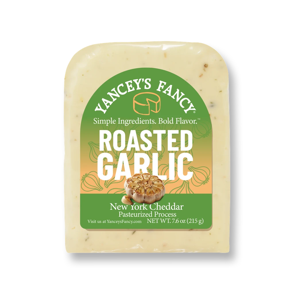 Yancey's Fancy Roasted Garlic Cheddar 7.6 ounce wedge in packaging.
