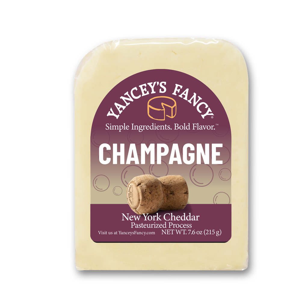 Yancey's Fancy Champagne Cheddar 7.6 ounce wedge in packaging.