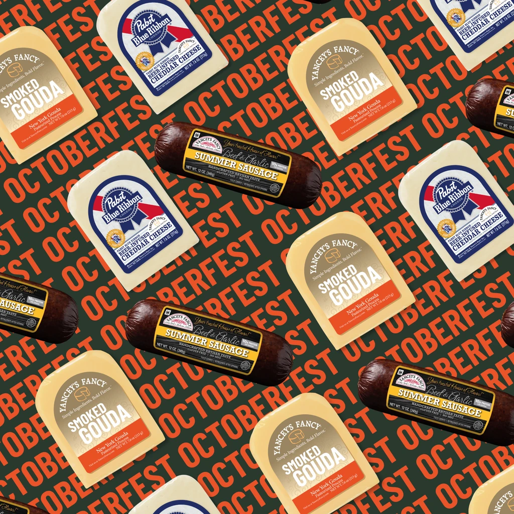 A repeating diagonal pattern of Dietz & Watson Beef & Garlic Summer Sauce, Yancey's Fancy Smoked Gouda and Pabst Blue Ribbon Cheddar arranged on a patterned background.