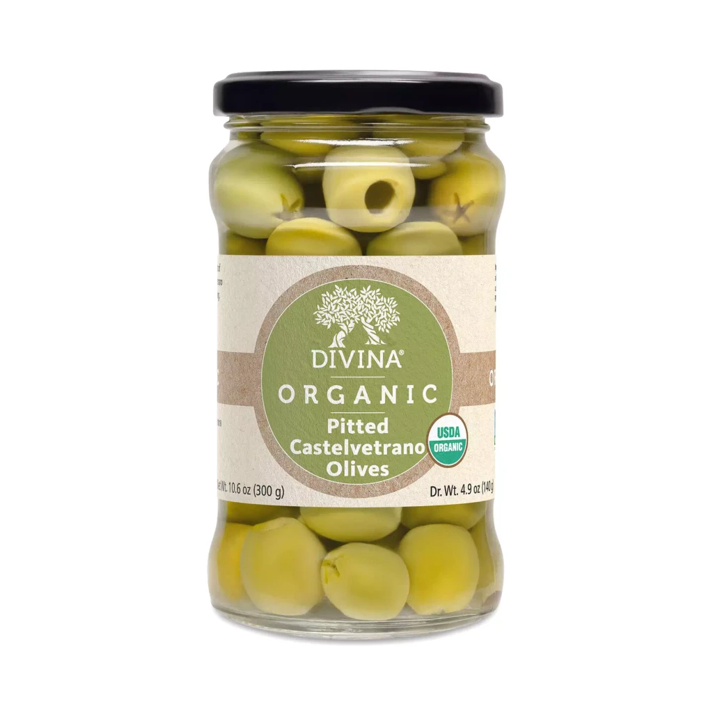 Jar of Divina organic pitted Castelvetrano olives, the briny bite featured in the Ultimate Feast gift box.