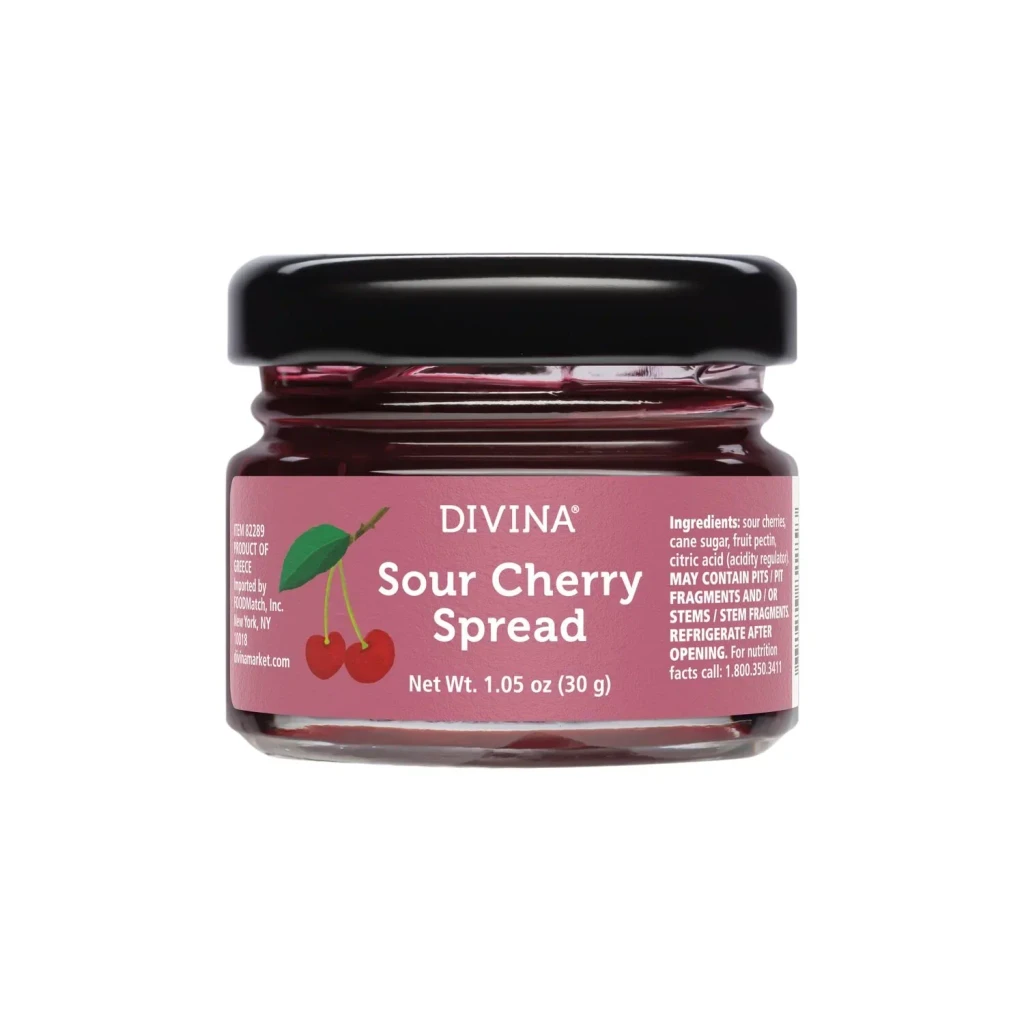 Mini jar of Divina sour cherry spread, the fruity condiment featured in the Grand Crate gift box.