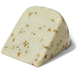 Unpackaged wedge of Yancey's Fancy Hatch Chile Cheddar Cheese.