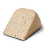 Unpackaged wedge of Yancey's Fancy Roasted Garlic Cheese.