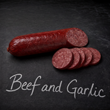 A 12-ounce log of Yancey's Fancy Beef & Garlic Summer Sausage sliced with flavor written in chalk.