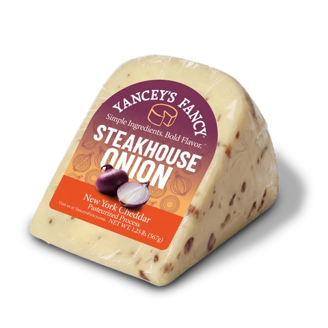 Side profile of packaged Yancey's Fancy Steakhouse Onion Cheddar New York cheese.