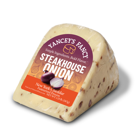Side profile of packaged Yancey's Fancy Steakhouse Onion Cheddar New York cheese.