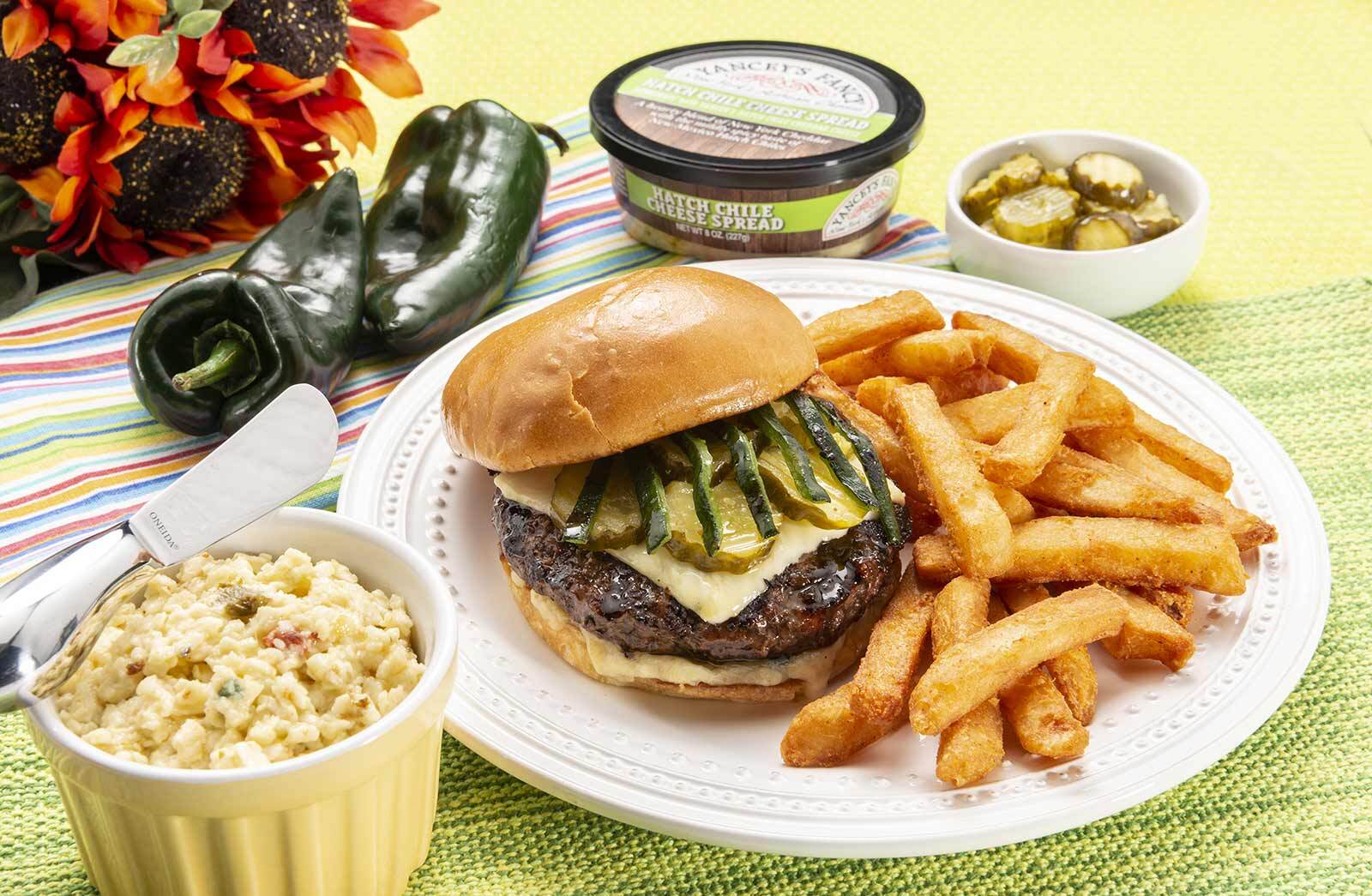 Yancey's Fancy Hatch Chile Cheeseburger recipe with melted artisan cheddar