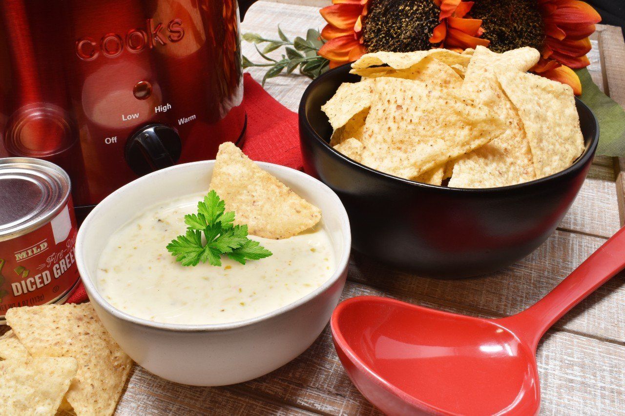 Yancey's Fancy Hatch Chile Queso dip made with fresh-grated artisan cheddar
