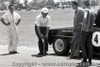 66085 - Norm Beechey Checking the tyre pressure of his Chev Nova - Warwick Farm 1966 - Photographer Lance J Ruting