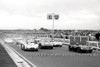 65478 - Start of the Sports Car Race - F. Matich, Lotus 19B / S. Martin, Ferrari 250LM / Ian Geoghegan, Lotus 23B / Ralp Sach, Mildren Maserati - Sandown 1965 - Photographer  Peter D'Abbs