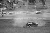 74428 - Russell Mills, Rolls his Morris Mini and is thrown from the car & trapped underneath. His seat belt snaped. Oran Park 3rd February 1974 - Photographer Lance J Ruting