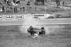 74427 - Russell Mills, Rolls his Morris Mini and is thrown from the car & trapped underneath. His seat belt snaped. Oran Park 3rd February 1974 - Photographer Lance J Ruting