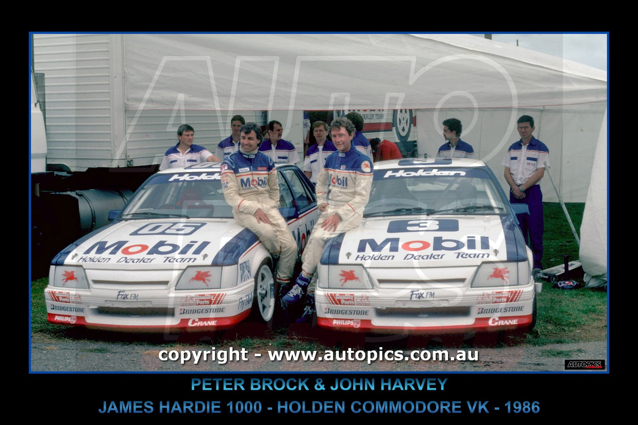 86761-F - Peter Brock &  John  Harvey  -  James Hardie 1000, Bathurst,  1986 - Holden Commodore VK - Printed with a black border and a caption describing the photo.
