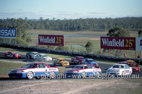 91027  -  Jim Richards & Mark Skaife, Nissan GT-R - Lead the field on the first lap -  Lakeside 14th July 1991 - Photographer Darren House