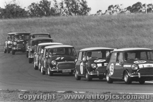 Minis  -   Morris Cooper S s snake like through the esses at  Oran Park - 1968