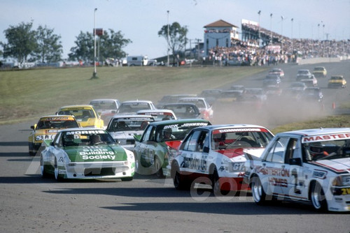 84611 - Steve Masterton, Ford XE Falcon Leads on the first lap - 1984 ATCC - Oran Park